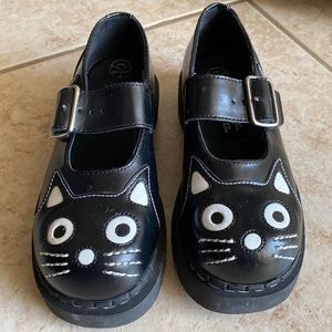 An archaic cat Mary Jane shoes